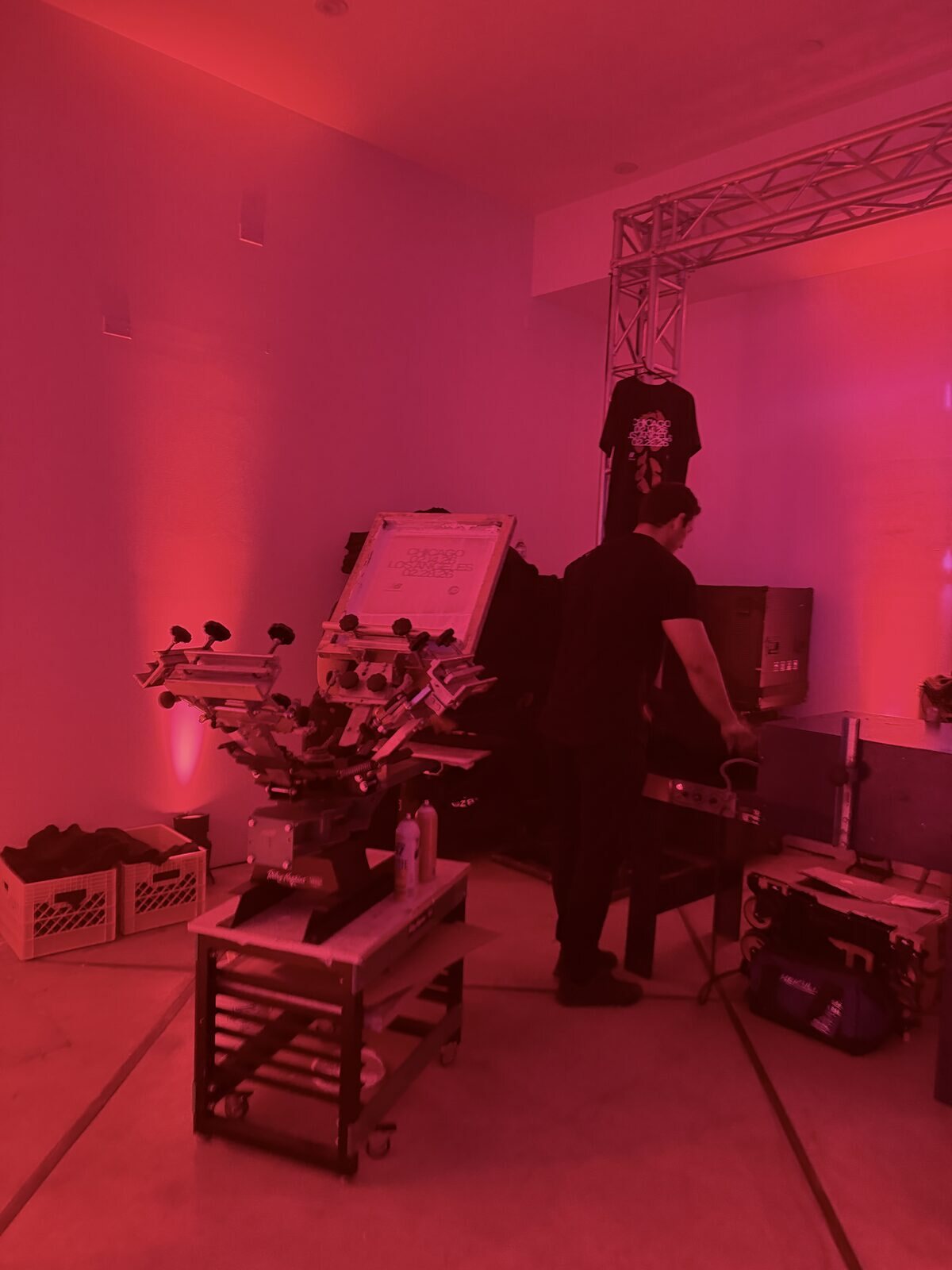 Equipment staged in a red-lit lounge before the launch party crowd arrived